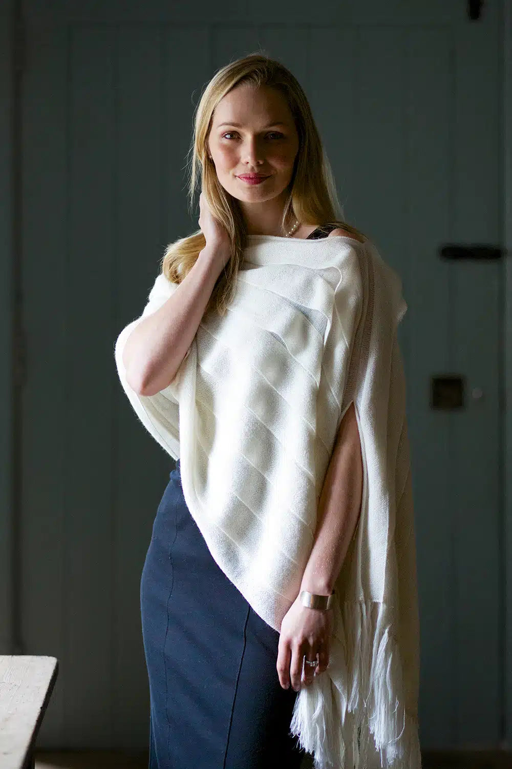 Cream luxury wool shawl by Lacorine, showcasing soft texture and elegant drape, perfect for stylish layering.