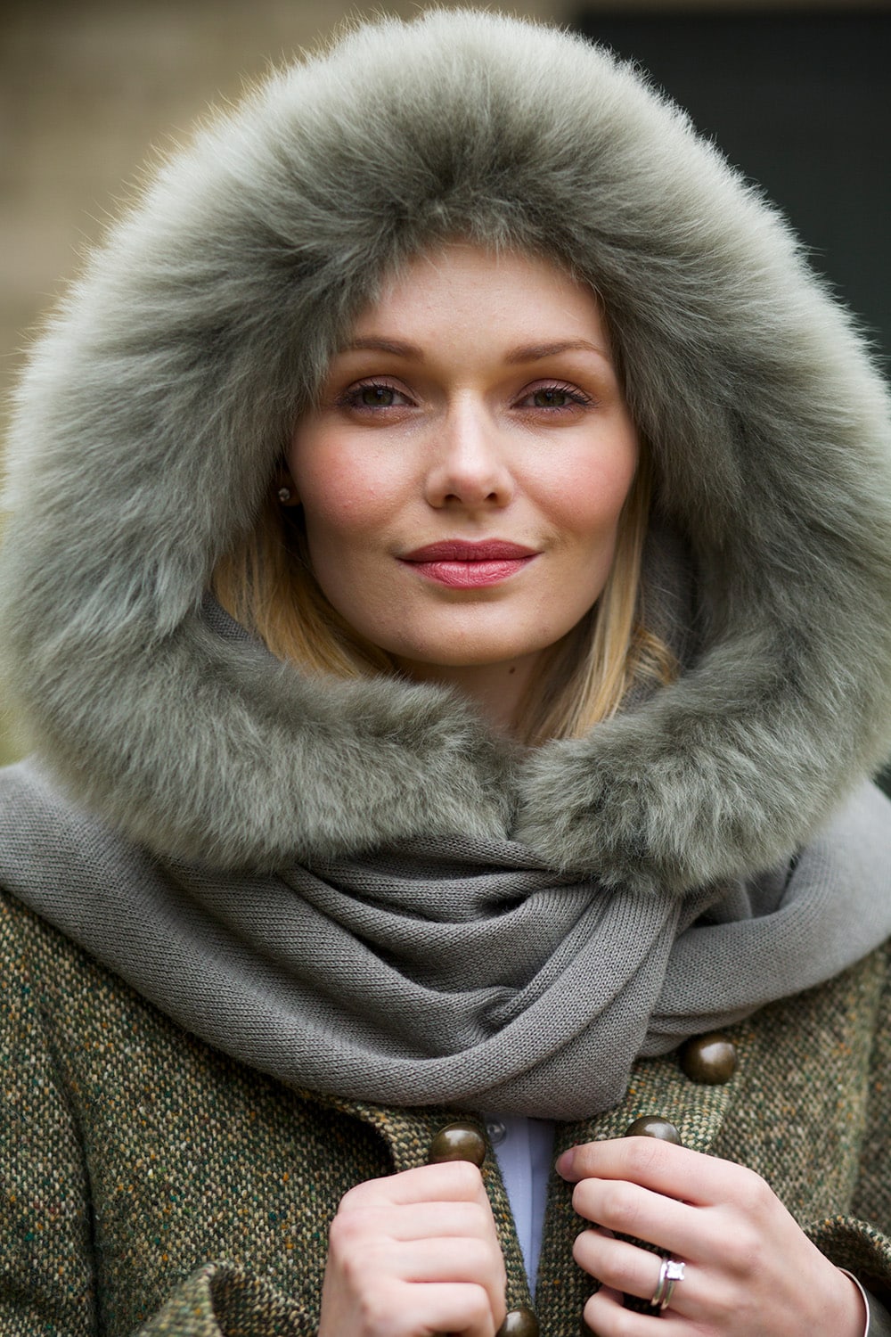 Lacorine Elysee Wool Shawl in Sherwood Green draped over a neutral background, showcasing its soft texture and elegant design.