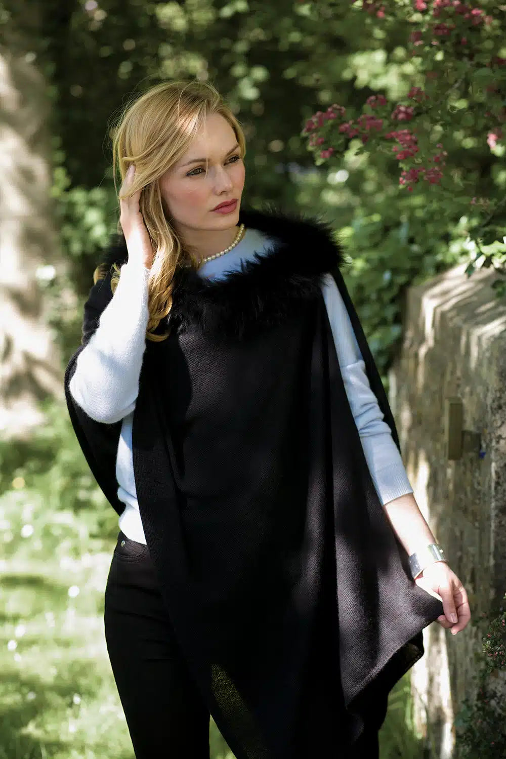 Black Lacorine Elysée Wool Shawl draped over a neutral background, showcasing its soft fabric and elegant design.