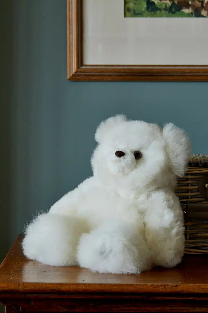Lacorine Super Luxe Corinne white alpaca fur teddy bear, soft plush toy with detailed stitching and a cozy, luxurious appearance.